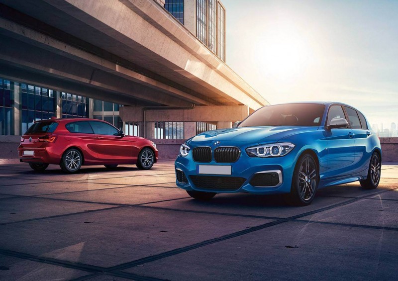 Two BMW 1 Series cars in red and blue