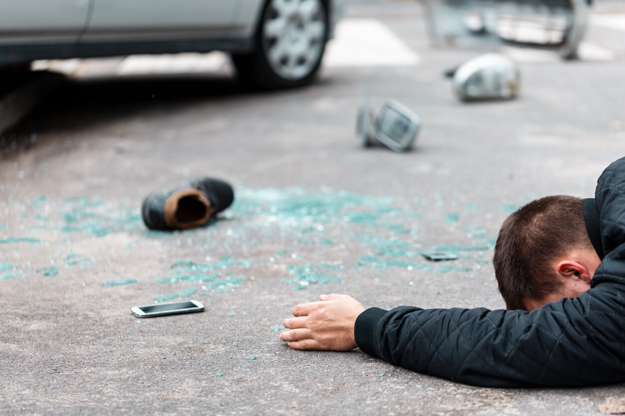 Man on floor after car accident