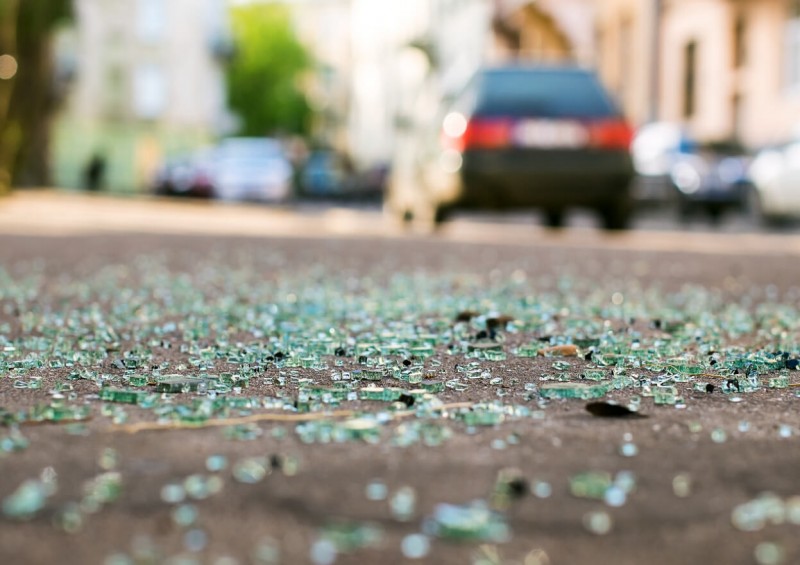 Broken glass on the road after car accident Broken glass on the road after car accident