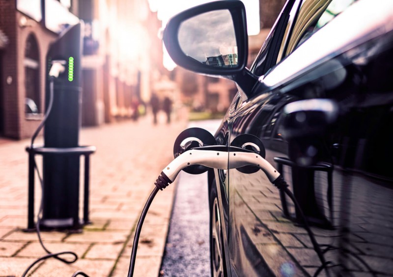 Electric or hybrid car charging on street Electric or hybrid car charging on street