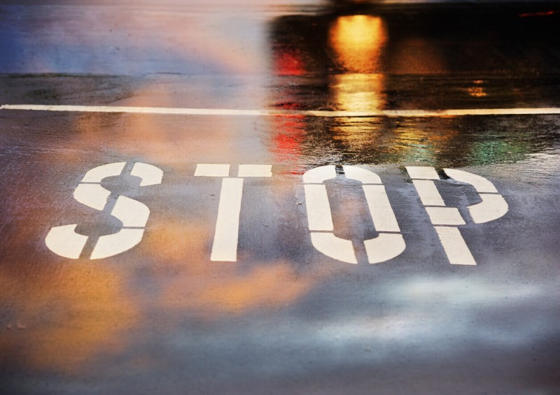 Stop sign on road floor